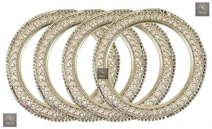 Golden kada set with artificial pearls and zircon gemstones in an intricate curved pattern.